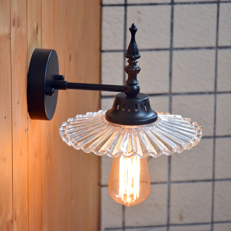 Light Up Your Space with Industrial Chic: The 1-Light Black Sconce with Clear/Green Glass