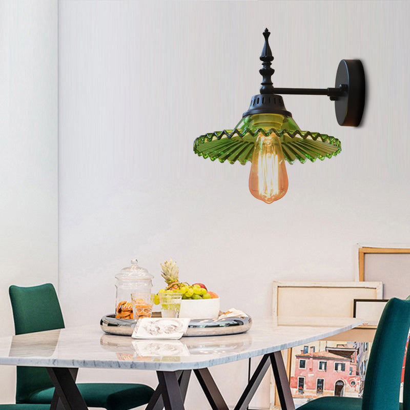 Light Up Your Space with Industrial Chic: The 1-Light Black Sconce with Clear/Green Glass