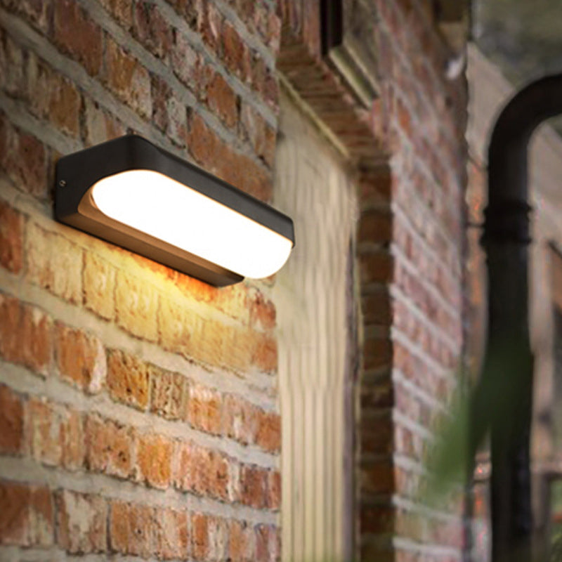 Sloane Modern Glow: Black Capsule Wall Sconce