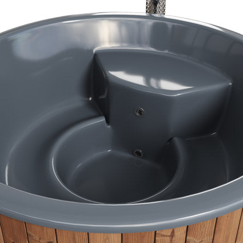 Gray bird bath with a fish-shaped water feature on a wooden deck.