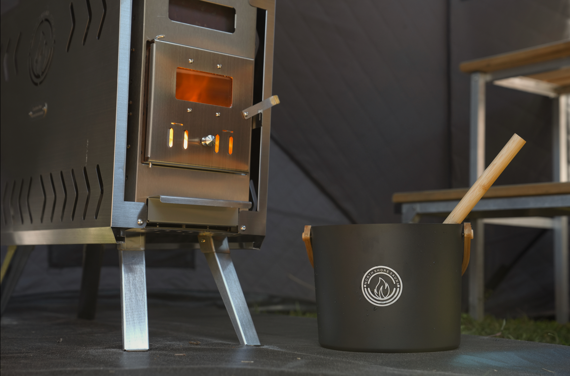 Wood-burning mini stove inside Mini Cube sauna tent reaching 200 degrees Fahrenheit in 15 minutes