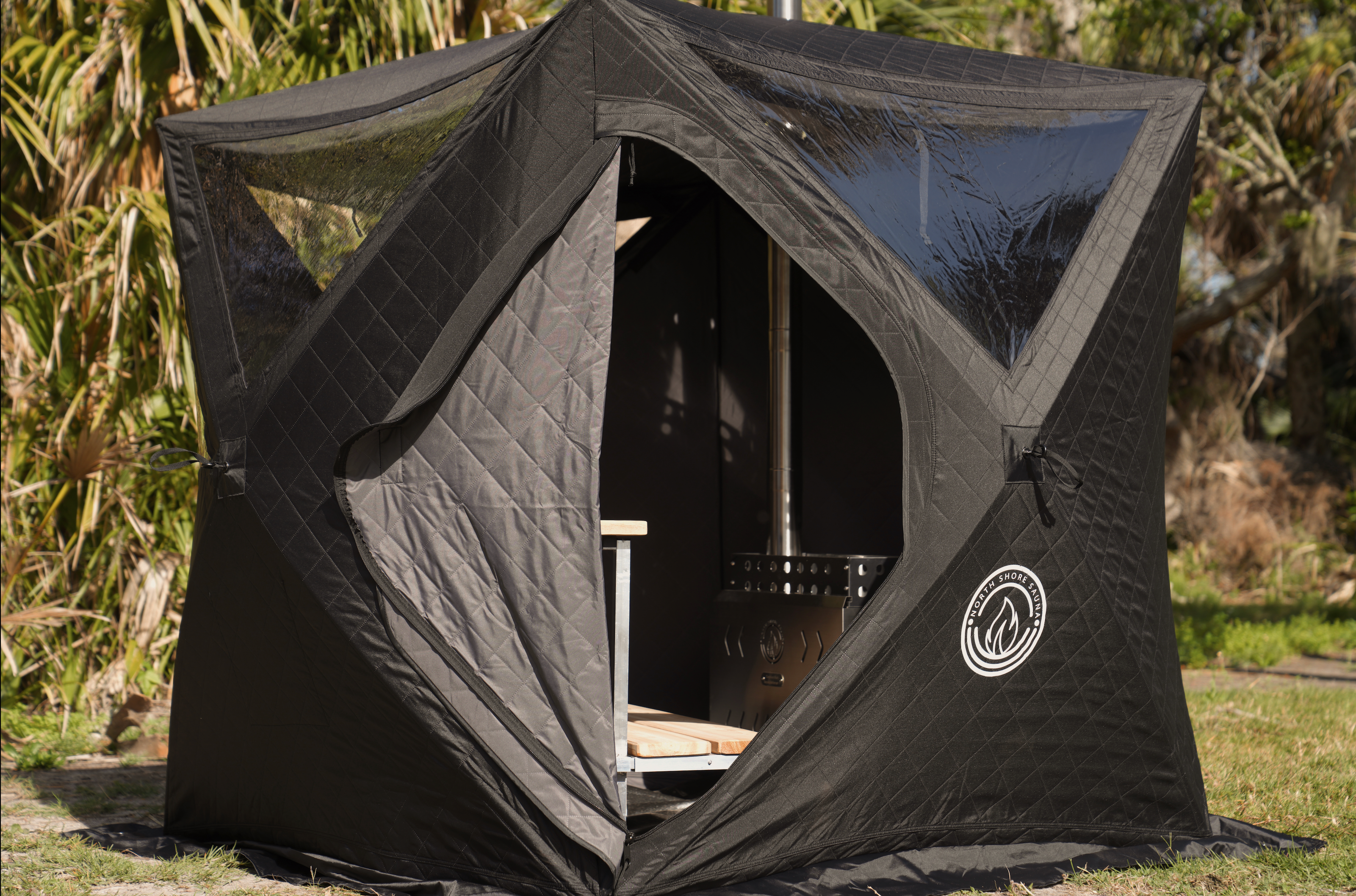 North Shore Sauna Mini Cube 2-person portable wood-fired sauna tent set up outdoors
